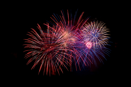 An assortment of fireworks on a black sky. Fourth of July celebrationの写真素材