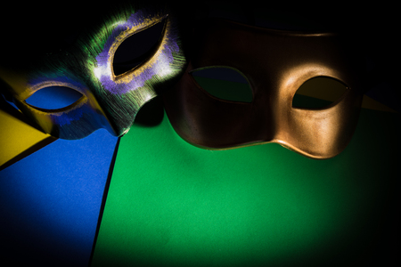 multiple Mardi Gras masks on a dark backgroundの写真素材