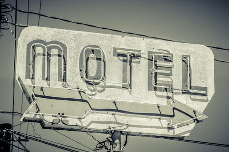 Old, vintage, flaking, motel sign with an arrowの写真素材