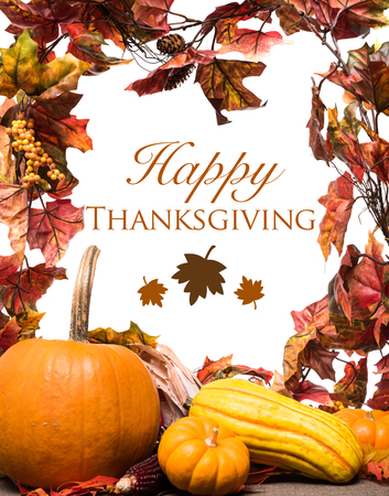 Fall, autumn pumpkins, leaves and veggies on a wooden background. Thanksgiving theme.の写真素材