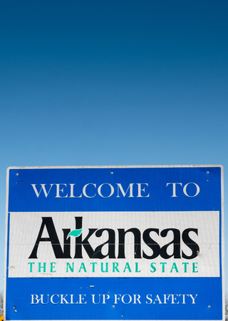 Welcome to Arkansas - the Natural Sate in front of blue skyの写真素材
