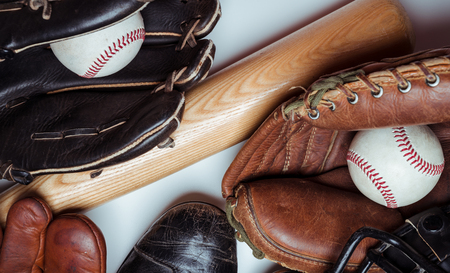 A group of vintage baseball equipment on a white backgroundの写真素材