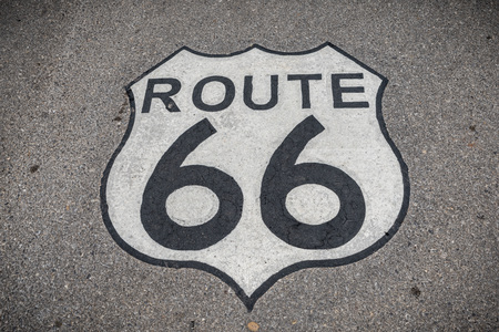 The famous route 66 highway shield painted on the roadの写真素材