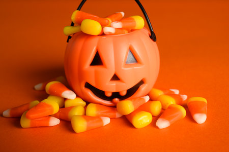 Jack-o-lantern halloween bucket with candy cornの写真素材