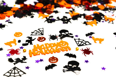 Assorted halloween confetti., jack-o-lantern, skeletons, skulls, spiders, batsの写真素材