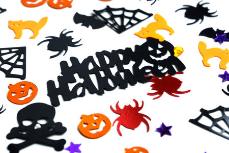 Assorted halloween confetti., jack-o-lantern, skeletons, skulls, spiders, batsの写真素材
