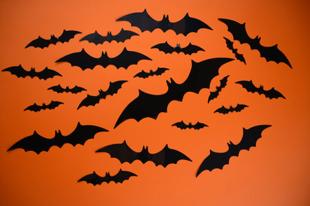 Halloween Bat Decorations on a orange backgroundの写真素材