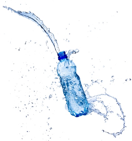 Fresh water splashing out of bottle, isolated on white backgroundの写真素材