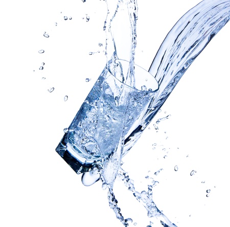 Fresh water splashing out of glass, isolated on white background の写真素材