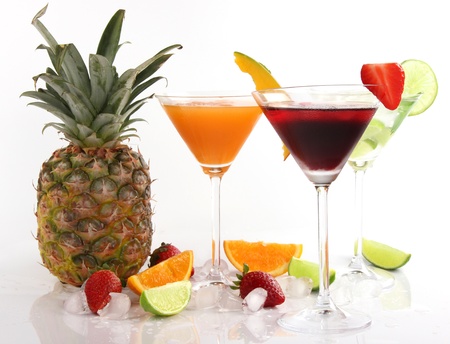 Tropical Martini drinks with fruits on white backgroundの写真素材