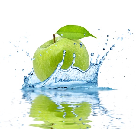 Green apple falling into water, isolated on white backgroundの写真素材