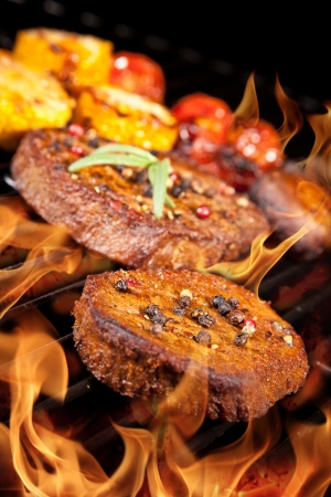 Delicious beef steaks on grillの写真素材