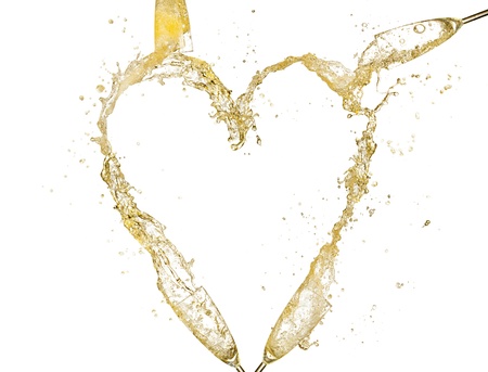 Concept of heart symbol made of splashing champagne from glasses  Isolated on white backgroundの写真素材