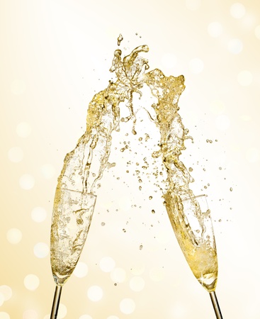 Splashing champagne out of glasses, concept of celebrationの写真素材