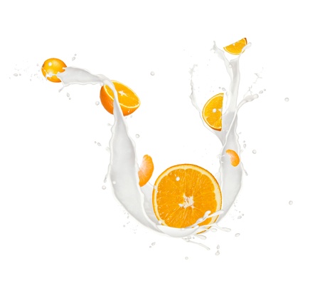 Oranges in milk splash, isolated on white backgroundの写真素材