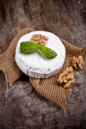 White goat cheese with noble rot on wooden tableの写真素材