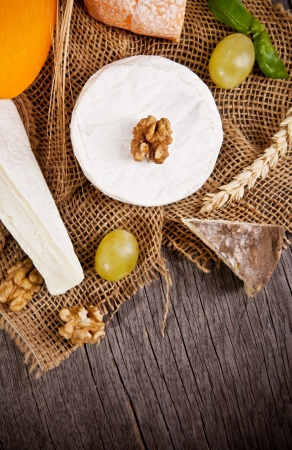  Delicious fresh french cheeses served on wooden tableの写真素材