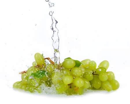 Grapes of white wine with water spalsh isolated on white backgroundの写真素材