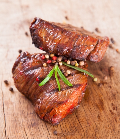 Delicious beef steaks on woodの写真素材