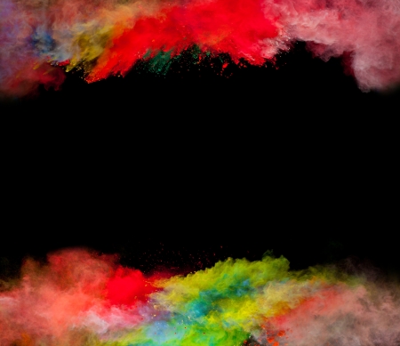 Freeze motion of colored dust explosion isolated on black backgroundの写真素材