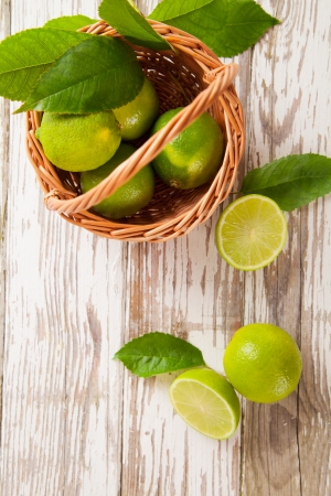 Fresh harvested limes in basketの写真素材