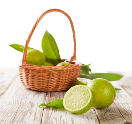 Fresh harvested limes in basketの写真素材