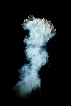 Freeze motion of white dust explosion isolated on black background