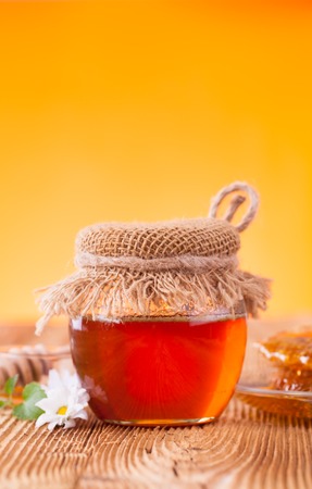 Still life of honey on wooden tableの写真素材
