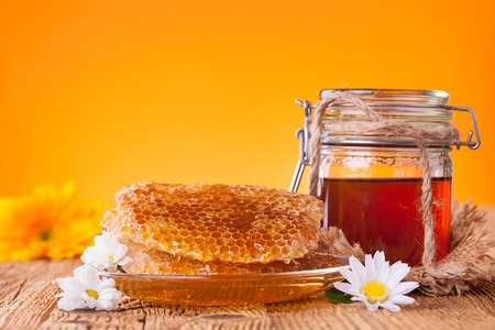 Still life of honey on wooden tableの写真素材