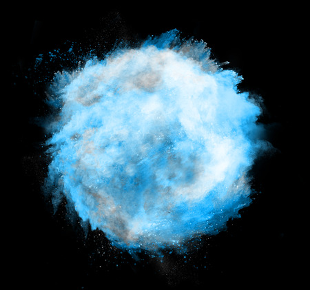 Freeze motion of blue dust sphere explosion isolated on black backgroundの写真素材