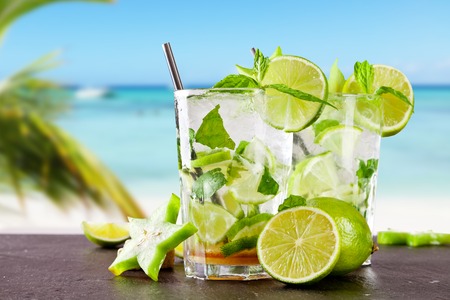 Mojito drink on wood with blur beach backgroundの写真素材