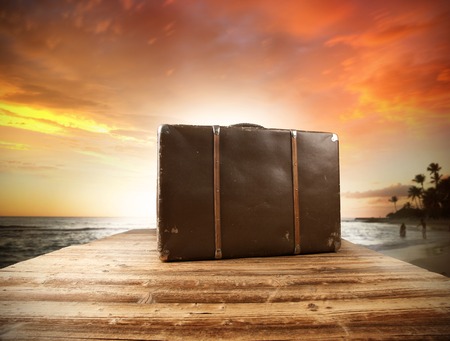 Concept of summer travelling with old suitcase  Blur beach の写真素材
