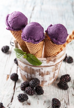 Studio photo of ice cream scoops in waffle cones  Served on wooden planksの写真素材