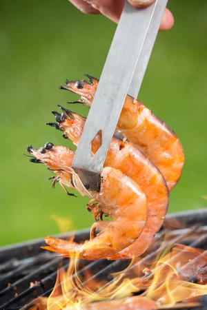Delicious grilled prawns on fire, macro photoの写真素材
