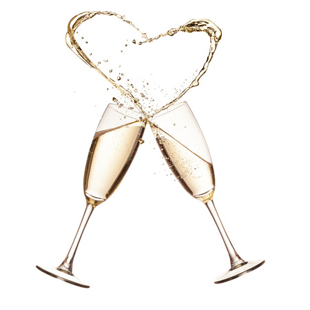 Two glasses of champagne with heart shape splash, isolated on white backgroundの写真素材