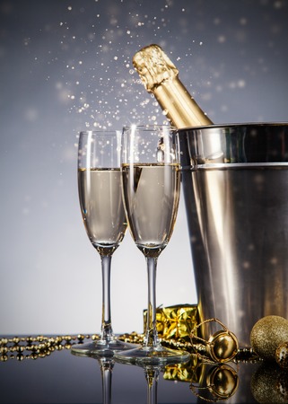 Champagne bottle with glasses. Celebration theme with champagne still lifeの写真素材