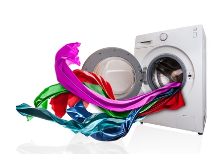 Colored cloth flying from washing machine, isolated on white backgroundの写真素材