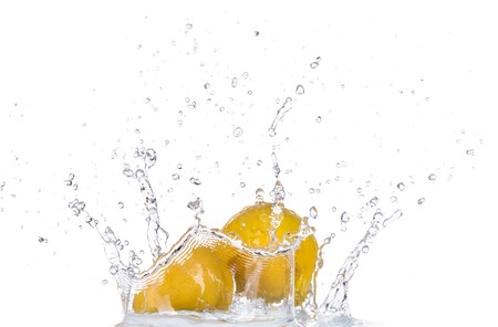 Fresh lemon in water splash isolated on white backroundの写真素材