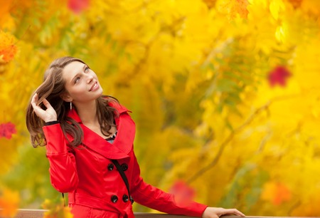 Beautiful young brunette woman portrait in autumn moodの写真素材