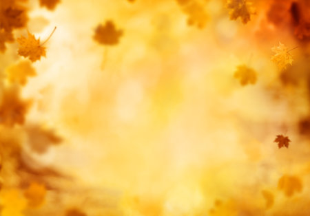 Abstract blur autumn background with falling leaves, copyspace for text