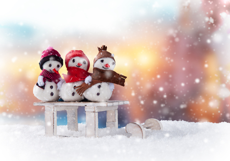 Christmas still life background with snowmen on sledgeの写真素材