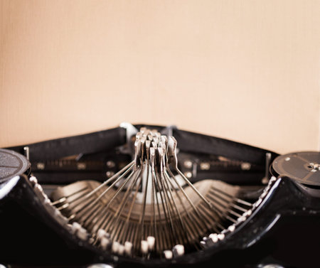 Antique typewriter with aged blank paper sheet for text