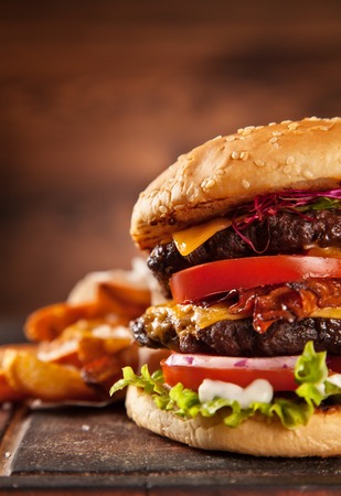 Delicious hamburger served on wooden planksの写真素材