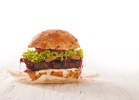 Delicious hamburger served on wooden planksの写真素材