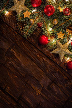 Christmas decoration with fir branches on wooden planks. Copyspace for textの写真素材
