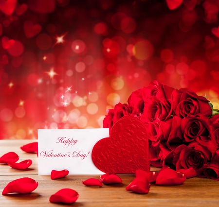 Valentines card on abstract shiny red background with copyspace for textの写真素材