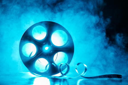 Old reel of film with smoke and backlightの写真素材