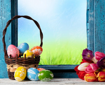 Easter still life decoration with rustic window and hand-painted eggs. Copyspace for text