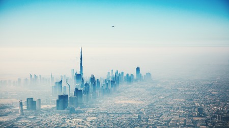 Dubai city in sunrise aerial view with foggy hazeの写真素材