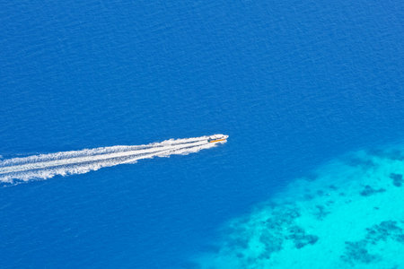 Speed boat from aerial view, Indian ocean, Maldives